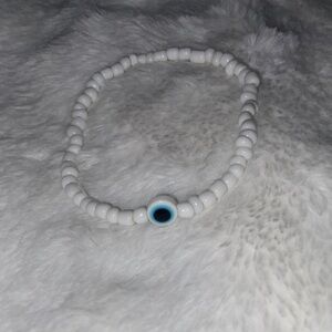 Handmade White Beaded Bracelet with Blue Accent